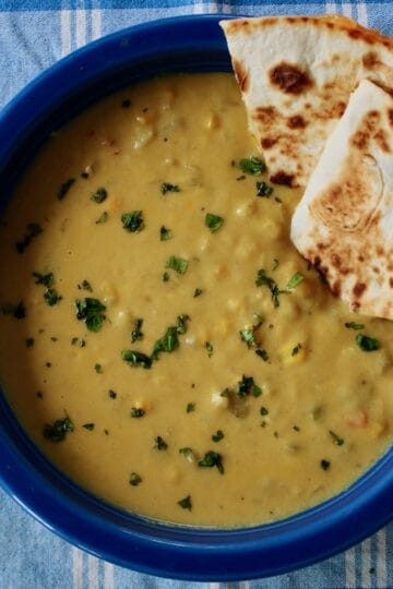 Bowl of corn chowder with quesadillas